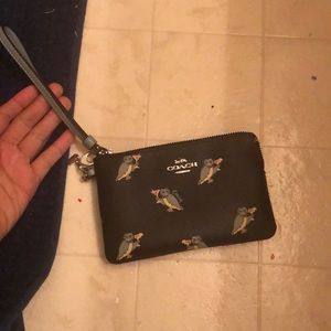 Coach wristlet with bird pattern
